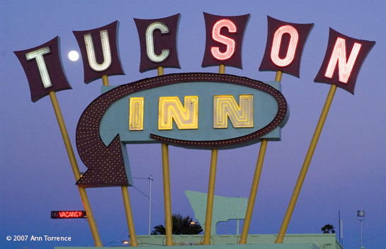 neon motel sign with full moon